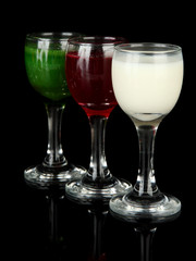 Tasty color liquors, isolated on black