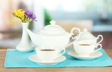 Beautiful tea service on wooden table