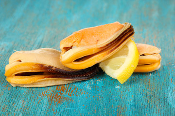 Mussels on blue wooden table