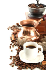 Cup and pot of coffee and coffee beans, isolated on white