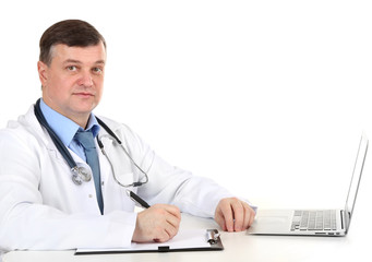 Medical doctor working at desk isolated on white