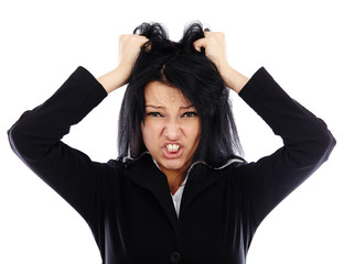 Portrait of an angry businesswoman pulling her hair