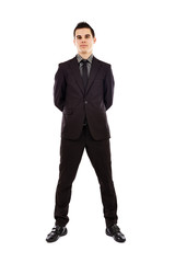 Young businesman looking at camera in full length pose