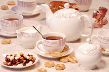 Obraz na płótnie Canvas tea time with sweet cookies and nuts