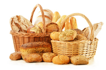  Bread and rolls in wicker basket isolated on white
