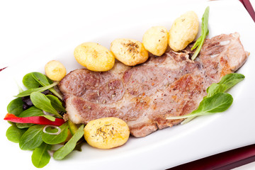 Steak Of Pork Neck With New Potatoes