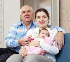   senior mature man and  mother with little baby