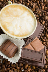 chocolate on coffee beans background