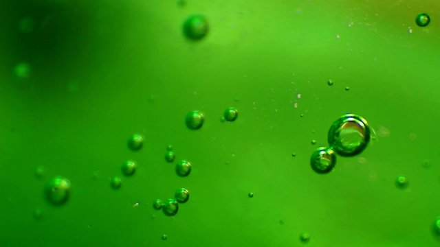 Bubbles in green gel. Extreme macro footage.