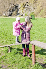 mother with her daughter at playground