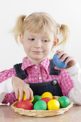 Fototapeta na wymiar portrait of little girl with Easter eggs