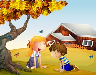 Fototapeten Kinder spielen mit den Schmetterlingen in der Nähe eines großen Baumes © GraphicsRF