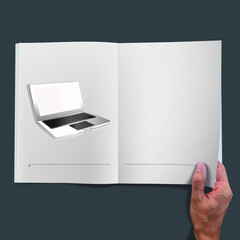 Modern laptop inside a book.