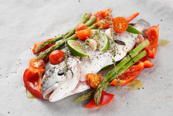 Dorade with vegetables prepared for roasting