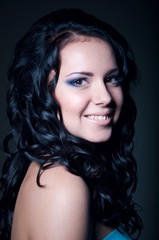 Fototapeta premium Brunette smiling girl with long hair