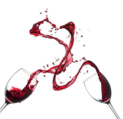 Concept of red wine splashing from glasses on white background