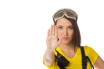 A female construction worker holding a stop signal - isolated.