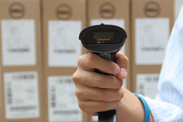 Barcode label scanner with label on the boxes background