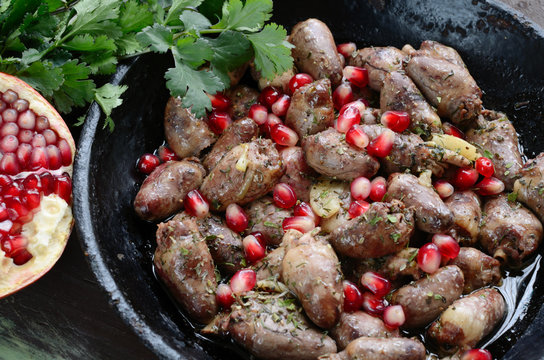 Fried chicken hearts with pomegranate in Georgian style