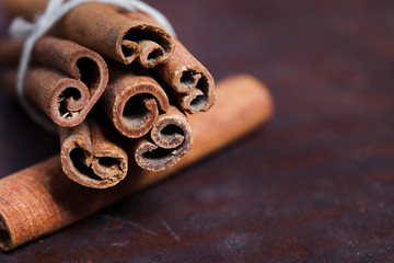Cinnamon sticks, shot close-up on the table.
