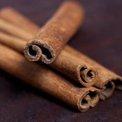 Cinnamon sticks, shot close-up on the table.
