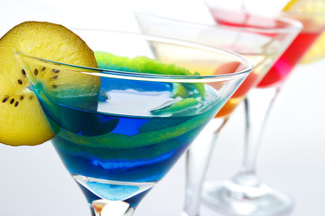 Colorful drinks in cocktail glasses closeup