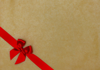 red ribbon on cardboard