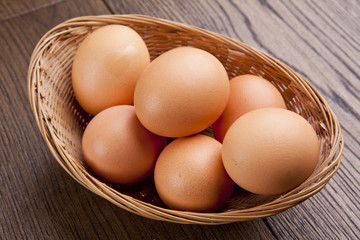 eggs in a bascket on wooden table