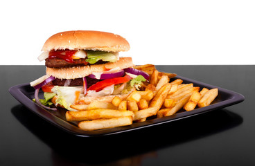 Hamburger with fries isolated on black and white background