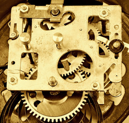 Inside the clock (watchwork), antique vintage clock mechanism