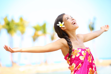 Free happy elated beach woman in freedom joy concept