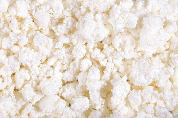 Fresh cottage cheese (curd) heap, isolated on white background .