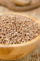 Buckwheat in a wooden bowl, closeup