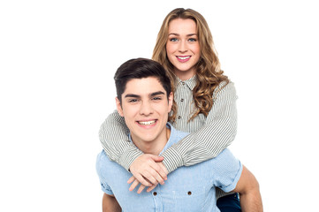 Happy young girl enjoying piggyback