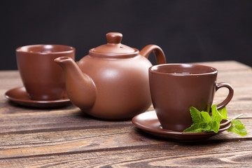 Tea with mint on a wooden table