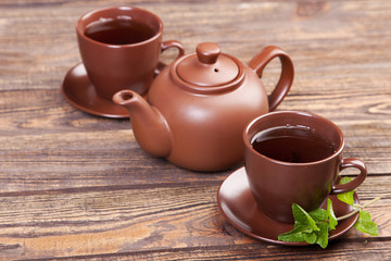 Tea with mint on a wooden table
