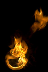 isolated fire flames on black background, darkness