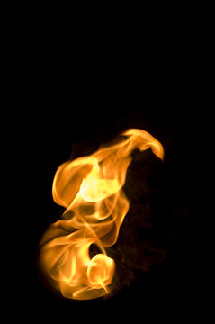 isolated fire flames on black background, darkness