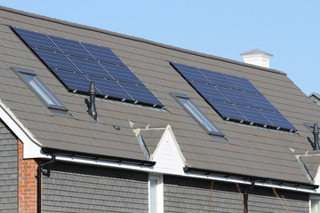 Solar photovoltaic panel arrays on house roof