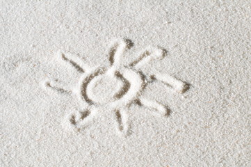 Sonnensymbol im Sand