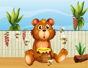 Un ours avec cinq abeilles