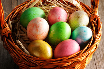 Colored easter eggs in basket