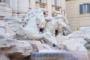 One of the two Tritons of the Trevi fountain, in Rome, Italy