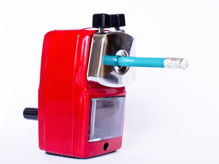 Red pencil sharpener on white background