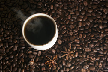 cup of coffee on a background coffee grains