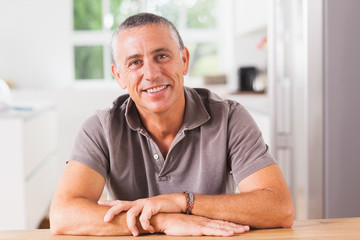 Happy man in kitchen