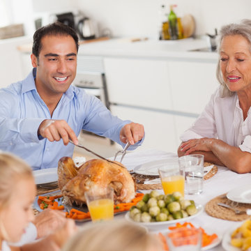 Man Carving The Thanksgiving Turkey