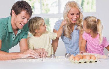 Son putting flour on the nose of his mother