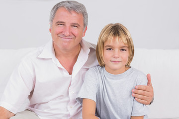 Portrait of a little boy and his grandfather