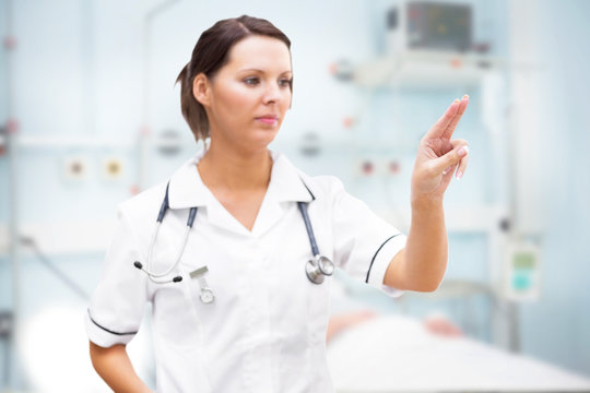 Nurse pointing at invisible screen